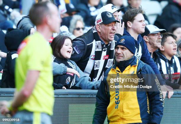 Magpies supporters get angry at the umpire during the round 17 AFL match between the Collingwood Magpies and the West Coast Eagles at Melbourne...