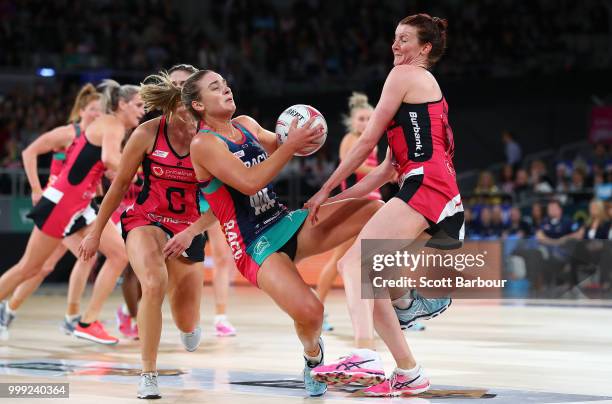 Liz Watson of the Vixens and Kate Shimmin of the Thunderbirds compete for the ball during the round 11 Super Netball match between the Vixens and the...