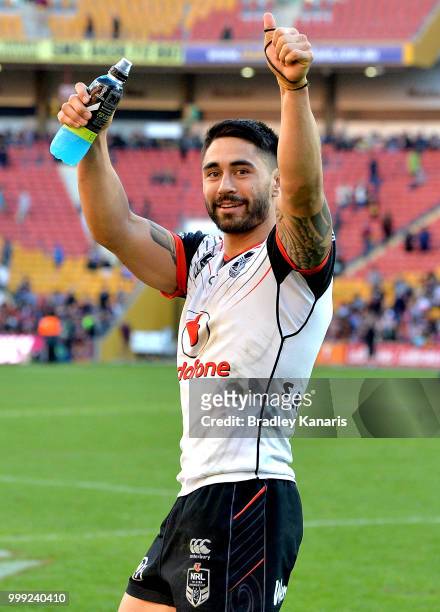 Shaun Johnson of the Warriors celebrates victory with fans after the round 18 NRL match between the Brisbane Broncos and the New Zealand Warriors at...