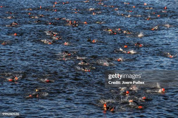 Athletes perform in the swim leg of the Age Group olympic distance race at the ITU World Triathlon Hamburg 2018 on July 15, 2018 in Hamburg, Germany.