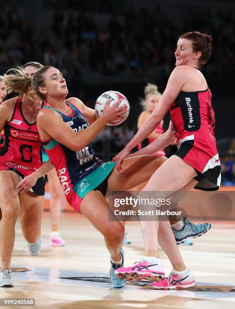 Liz Watson of the Vixens and Kate Shimmin of the Thunderbirds compete for the ball during the round 11 Super Netball match between the Vixens and the...