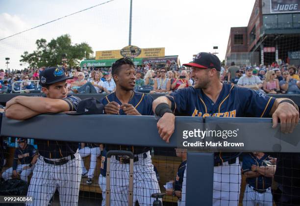 Mandy Alvarez, Jan Hernandez and Tim Tebow of the Eastern Division All-Stars in the dugout during the 2018 Eastern League All Star Game at Arm &...