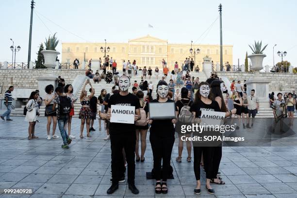 Activists with anonymous face masks during a demonstration by vegan activists for the 'voiceless' on Syntagma Square.