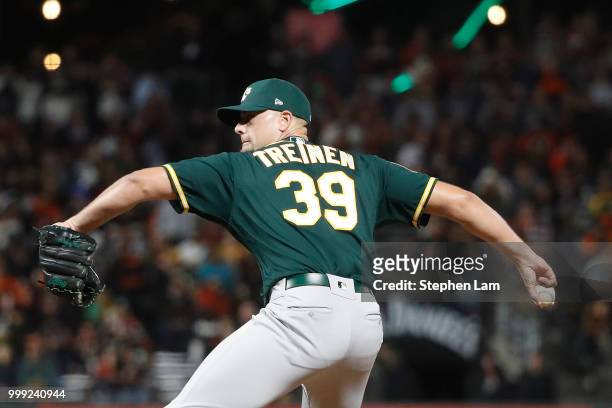 Blake Treinen of the Oakland Athletics delivers a pitch during the ninth inning against the San Francisco Giants at AT&T Park on July 14, 2018 in San...