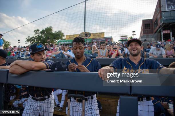 Mandy Alvarez, Jan Hernandez and Tim Tebow of the Eastern Division All-Stars in the dugout during the 2018 Eastern League All Star Game at Arm &...