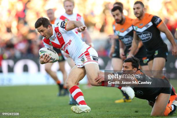 Ben Hunt of the Dragons runs the ball during the round 18 NRL match between the St George Illawarra Dragons and the Wests Tigers at UOW Jubilee Oval...