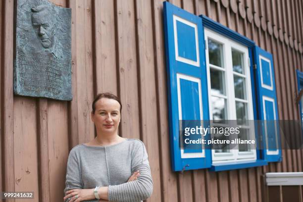 Dpatop - Lina Motuziene, the director of the Thomas Mann House, outside the Mann's summer house in which German writer Thomas Mann stayed during...