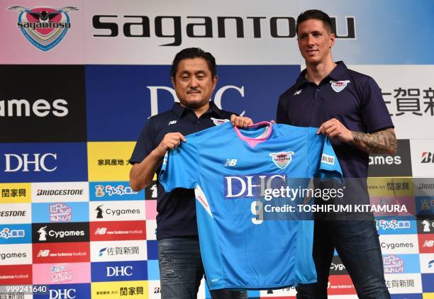 Spanish football star Fernando Torres and Sagan Dreams president Minoru Takehara pose during a press conference welcoming Torres to the J-League club...