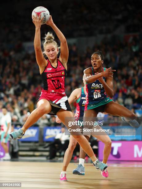 Kadie-Ann Dehaney of the Vixens and Charlee Hodges of the Thunderbirds compete for the ball during the round 11 Super Netball match between the...