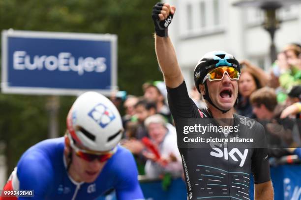 Elia Viviani of Italy celebrates his victory at the finish of the Euro Eyes Cyclassics in Hamburg, Germany, 20 August 2017. Arnaud Demare of France...