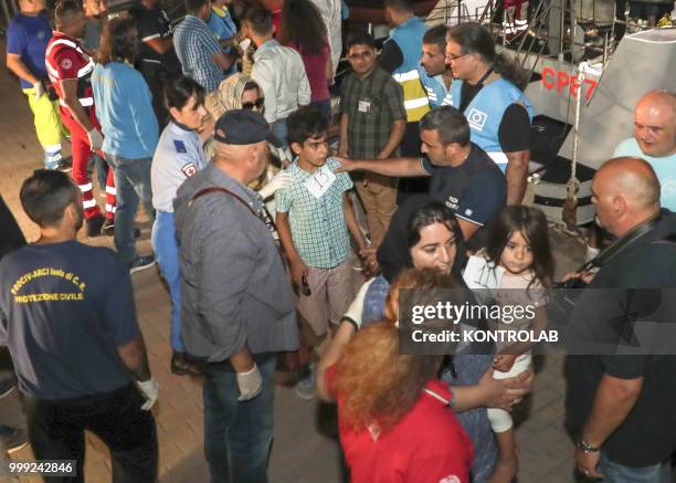 The landing stages of 75 Iraqi Kurdish refugees arrived in the port of Crotone after being intercepted by a patrol boat of the Guardia di Finanza 12...