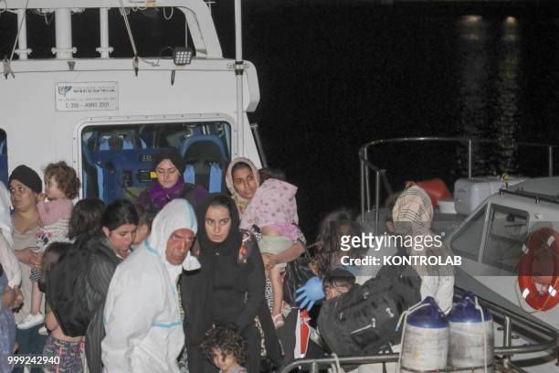 The landing stages of 75 Iraqi Kurdish refugees arrived in the port of Crotone after being intercepted by a patrol boat of the Guardia di Finanza 12...