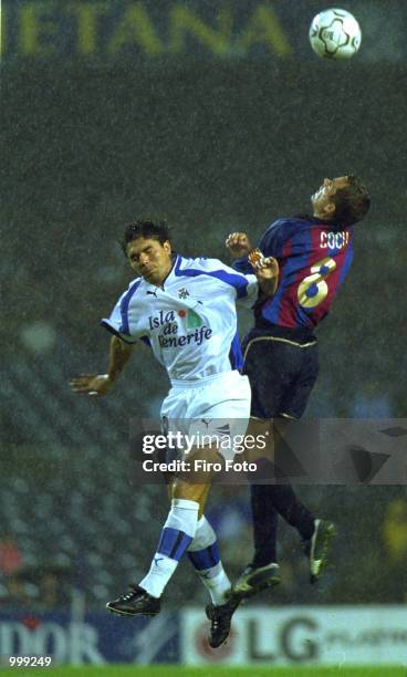 Cocu of Barcelona and Fuertes of Tenerife in action during the Primera Liga match between Barcelona v Tenerife at the the Nou Camp, Barcelona, Spain....