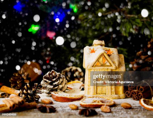 christmas card with little toy house and decorations on a wooden rustic table, selective focus - card table stock pictures, royalty-free photos & images