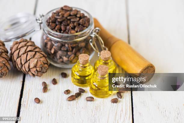 the cedar oil in a glass bottle - cedar stock pictures, royalty-free photos & images