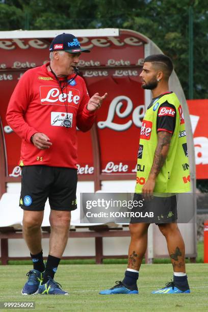 Napoli's Italian coach Carlo Ancelotti talks with Napoli's Italian striker Lorenzo Insigne during the pre-season praparation on July 13 2018 at...