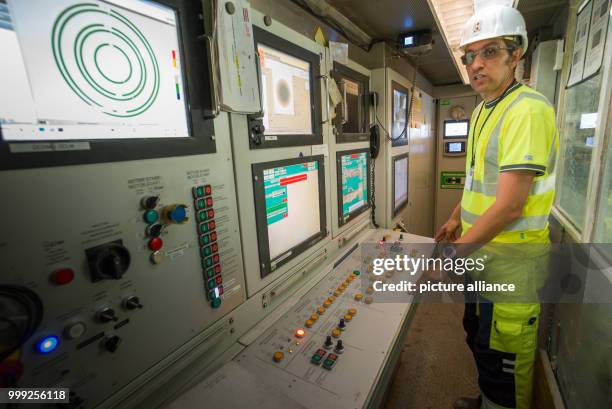 Project leader Andrea Lussu standing in the control centre of the tunnel drilling machine in a section of construction site for the Brenner Base...