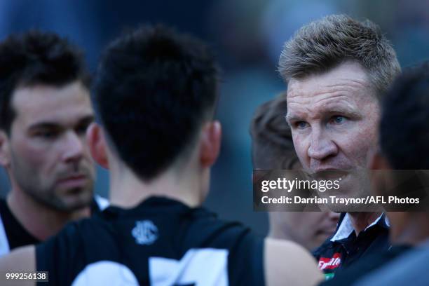 Nathan Buckley, Senior Coach of the Magpies speaks to his players during the round 17 AFL match between the Collingwood Magpies and the West Coast...