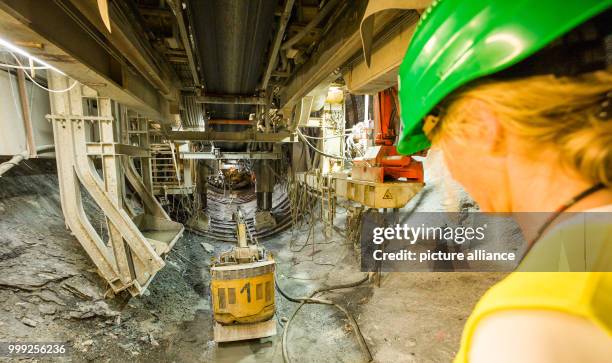 Dpatop - A journalist looking into a section of construction site for the Brenner Base Tunnel near Innsbruck, Austria, 18 August 2017. The planned...