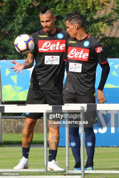 Napoli's Slovakian midfielder Marek Hamsik and Napoli's Spanish striker Jose Maria Callejon chat during the pre-season praparation on July 13 2018 at...