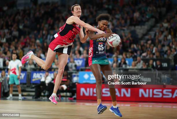 Mwai Kumwenda of the Vixens and Kate Shimmin of the Thunderbirds compete for the ball during the round 11 Super Netball match between the Vixens and...