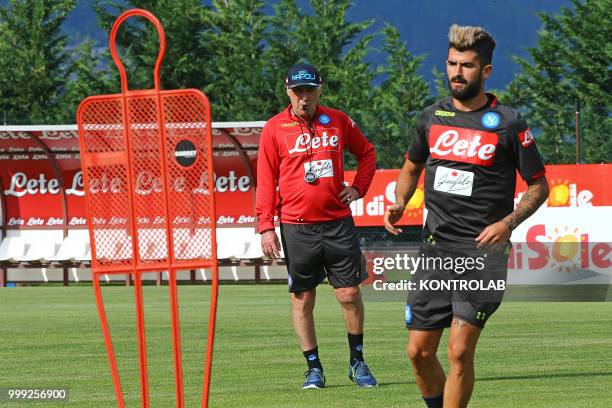 Napoli's Italian coach Carlo Ancelotti looks at Napoli's Albanian defender Elseid Hysaj during the pre-season praparation on July 13 2018 at Carciato...