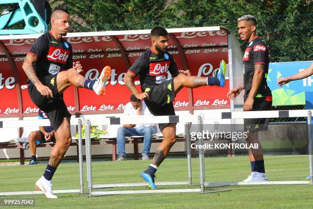 Napoli's Slovakian midfielder Marek Hamsik and Napoli's Italian striker Lorenzo Insigne is training next to Napoli's Brazilian midfielder Allan...