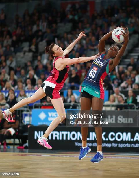 Mwai Kumwenda of the Vixens and Kate Shimmin of the Thunderbirds compete for the ball during the round 11 Super Netball match between the Vixens and...