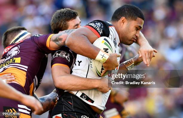 Tevita Satae of the Warriors takes on the defence during the round 18 NRL match between the Brisbane Broncos and the New Zealand Warriors at Suncorp...