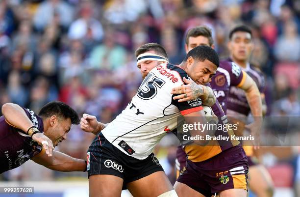 Tevita Satae of the Warriors takes on the defence during the round 18 NRL match between the Brisbane Broncos and the New Zealand Warriors at Suncorp...