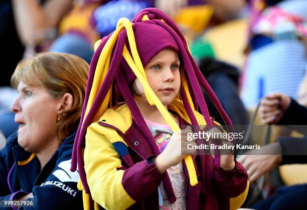 Young Broncos fan shows her colours during the round 18 NRL match between the Brisbane Broncos and the New Zealand Warriors at Suncorp Stadium on...