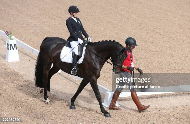 German para dressage rider Alina Rosenberg riding Nea's Daboun is taken to a dressage event at the Longines FEI European Championships 2017 in...