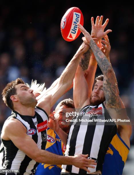 Levi Greenwood of the Magpies, Jack Darling of the Eagles, Jeremy Howe of the Magpies and Josh Kennedy of the Eagles compete for the ball during the...