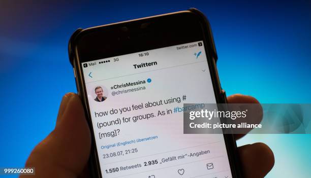 The first tweet featuring a hashtag on messaging service Twitter pictured on a smartphone in Berlin, Germany, 21 August 2017. The tweet was sent on...