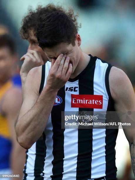 Jack Crisp of the Magpies looks dejected after a loss during the 2018 AFL round 17 match between the Collingwood Magpies and the West Coast Eagles at...