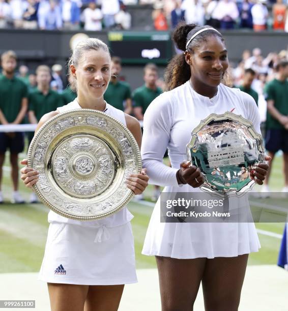 Angelique Kerber of Germany, winner of the women's singles final at Wimbledon, and runner-up Selena Williams of the United States pose for photos...