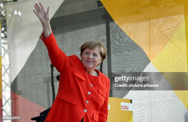 German Chancellor Angela Merkel on stage at a CDU election campaign event in St.Peter-Ording, Germany, 21 August 2017. Photo: Carsten Rehder/dpa