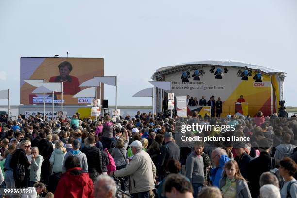 German Chancellor Angela Merkel speaking at a CDU election campaign event in St.Peter-Ording, Germany, 21 August 2017. Photo: Carsten Rehder/dpa