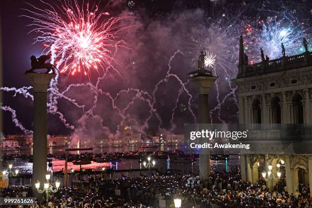 The fireworks display on the San Marco basin, seen from the Palazzo Ducale loggia, on the occasion of the traditional feast of the Holy redeemer on...