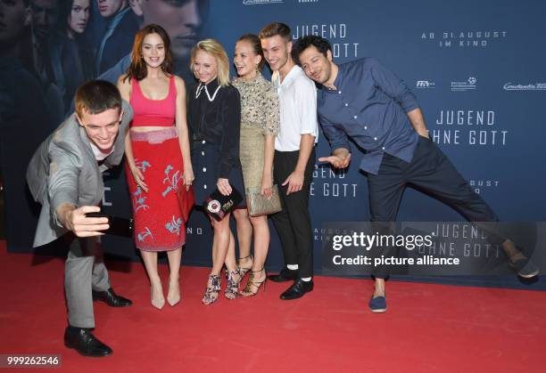 Actors Jannis Niewoehner , Emilia Schuele, Anna Maria Muehe, Alicia von Rittberg, Jannik Schuemann and Fahri Yardim take a selfie at the film...