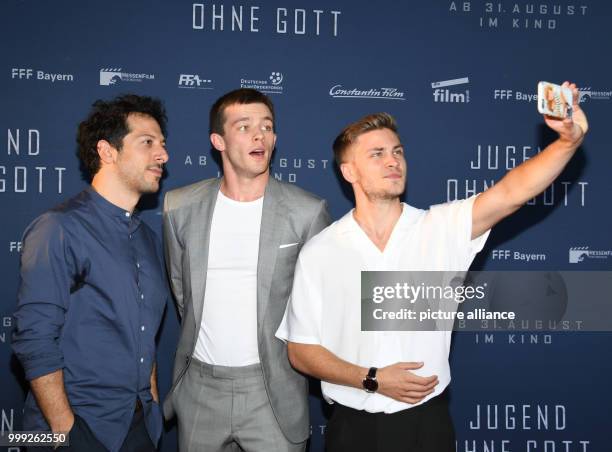 Actors Fahri Yardim , Jannis Niewoehner and Jannik Schuemann arrive at the film premiere of "Jugend ohne Gott" at the Mathaeser Filmpalast in Munich,...