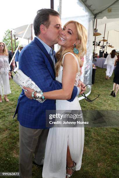 Rob Sharp and Ramy Brook Sharp attend Samuel Waxman Cancer Research Foundation's 14 Annual The Hamptons Happening on July 14, 2018 in Bridgehampton,...
