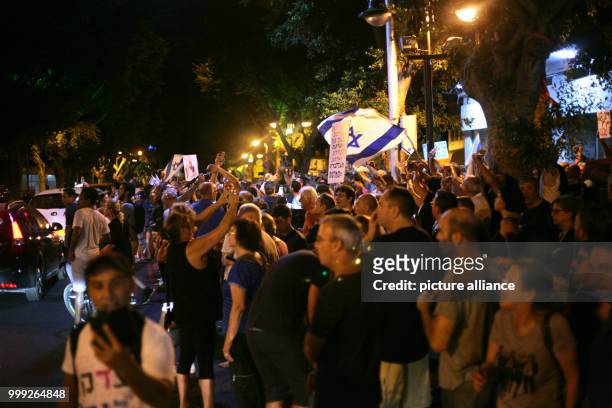 Israeli protesters hold a weekly anti-corruption rally in Petah Tikva, Israel, 19 August 2017. The protesters seek to pressure Israel's attorney...