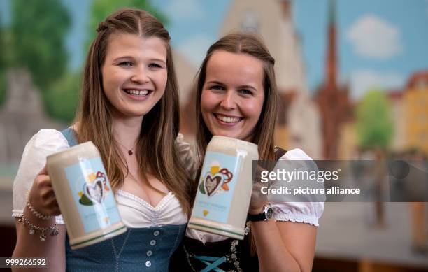 Isabelle and Sarah present the official Oktoberfest 2017 beer tankard at a press conference in Munich, Germany, 22 August 2017. The festival opens on...