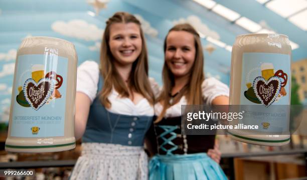 Isabelle and Sarah present the official Oktoberfest 2017 beer tankard at a press conference in Munich, Germany, 22 August 2017. The festival opens on...