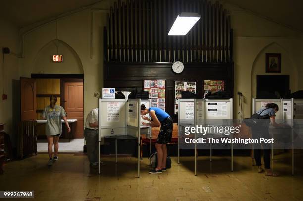Voters vote at the Goodwill Baptist Church in Adams Morgan in Washington, D.C., June 19 to vote during DC's primary. Council Member Brianne Nadeau is...