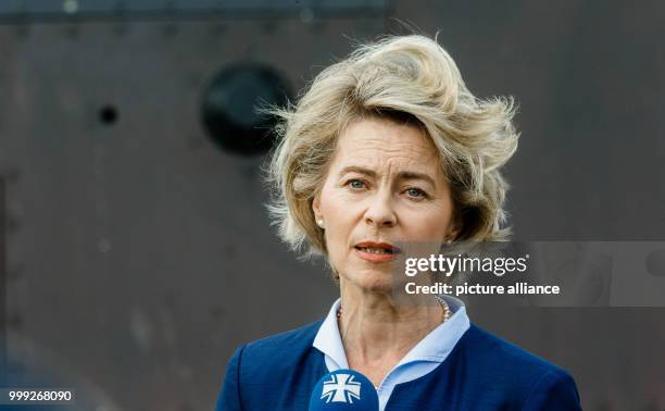 German defence minister Ursula von der Leyen stands in front of the U35 submarine during a visit to the German naval base and submarine training base...