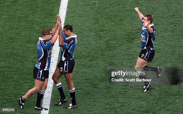 The Sharks celebrate after scoring a try during the NRL second semi final match between the Bulldogs and the Cronulla Sharks held at the Sydney...