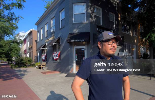 The owner of Cornercopia, Albert Oh stands in front of his store at the corner of 3rd and K Streets SE. Story is about the massive change in the...