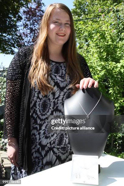 Abduction victim Natascha Kampusch presents a necklace of her five-piece jewellery collection in Vienna, Austria, 21 August 2017. The flower - as a...